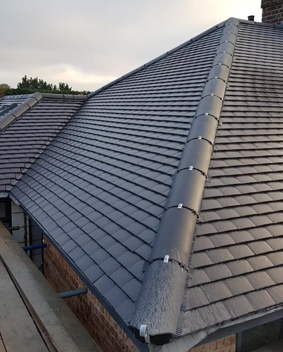 New grey tiled roof dry ridge