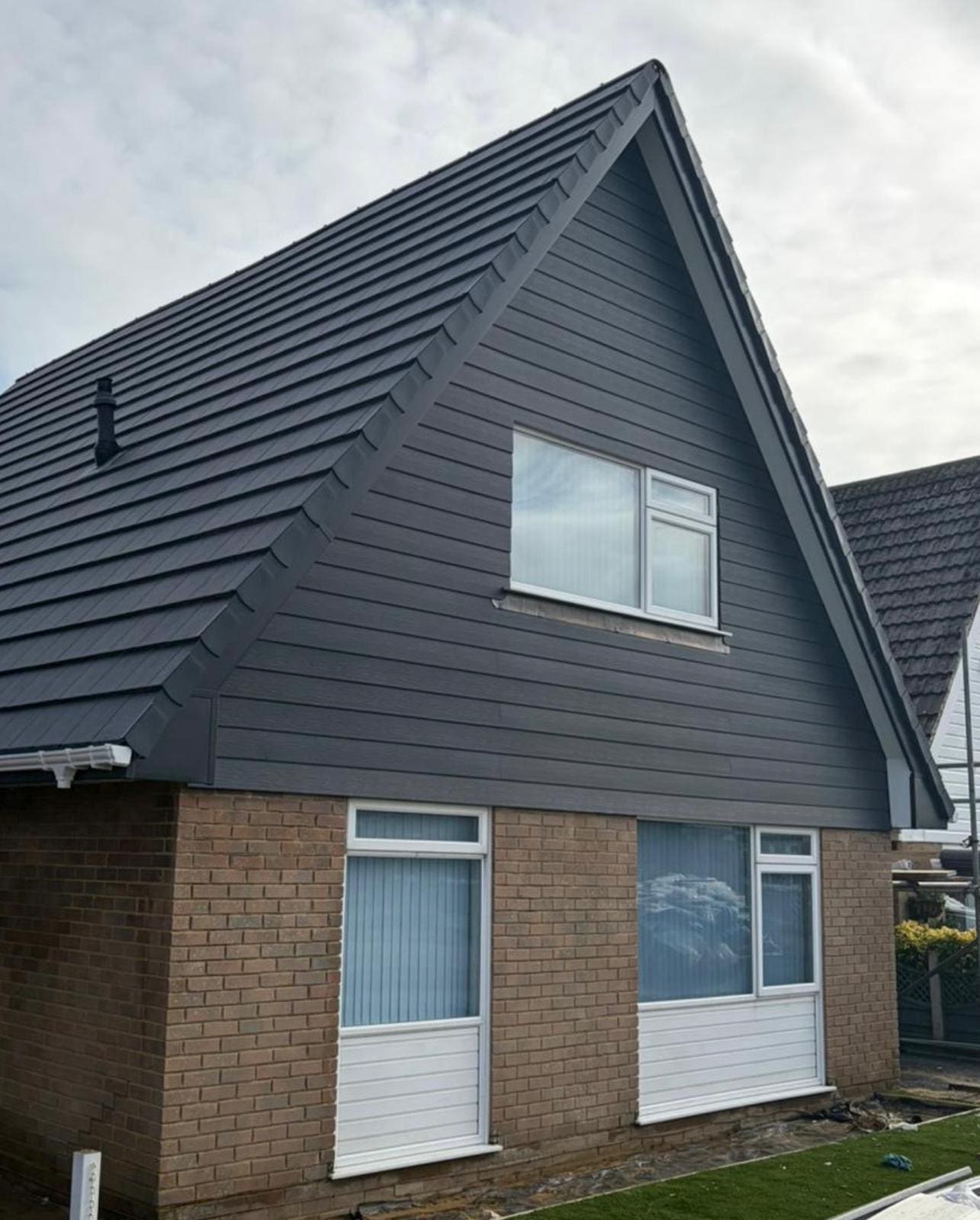Dark tiled hipped roof